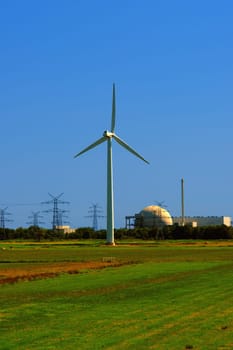Wind turbine in front of Unterweser nuclear power plant