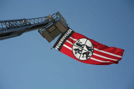 Fire brigade flag on an extended turntable ladder