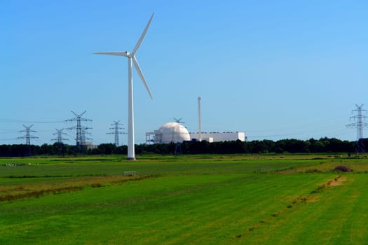 Wind turbine in front of Unterweser nuclear power plant