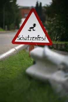 Warning sign in our village at the shooting festival time
