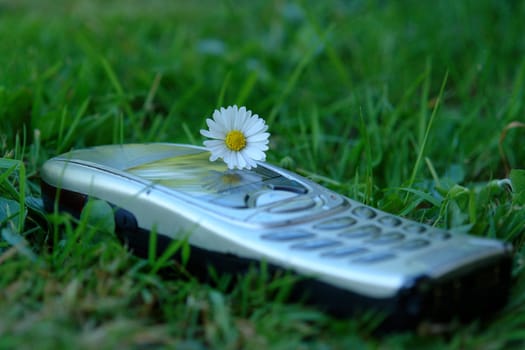 Mobile phone on meadow