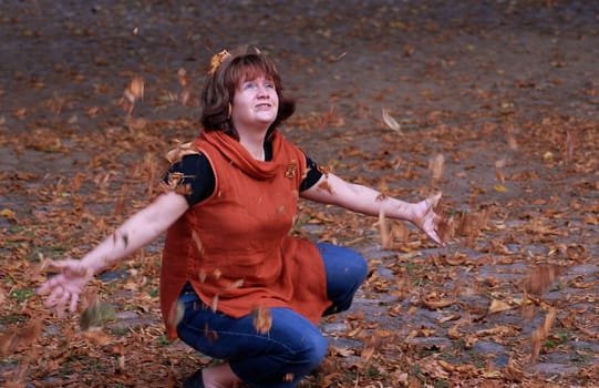 The beautiful side of autumn--- woman can become a child again