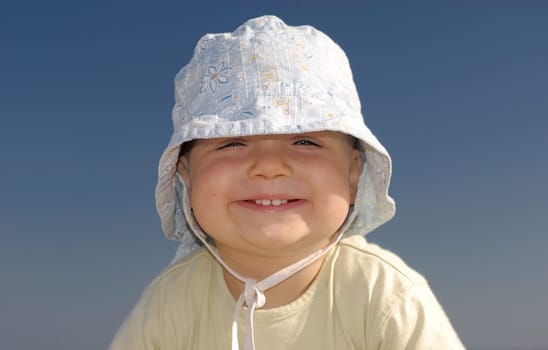 Children's portrait of a girl on the beach