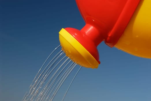 Water flows from watering can