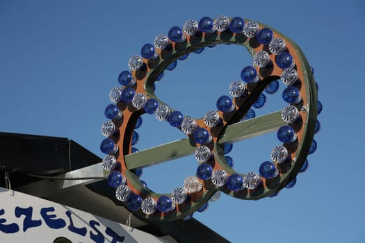 Illuminated advertisement at a pretzel stand