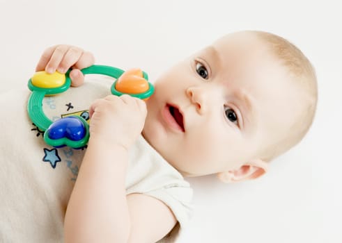 Baby with rattle (about 4 months old)