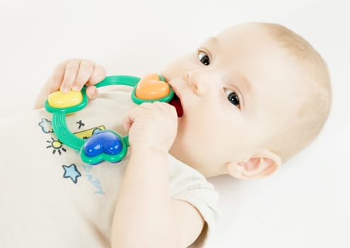 Baby with rattle (about 4 months old)