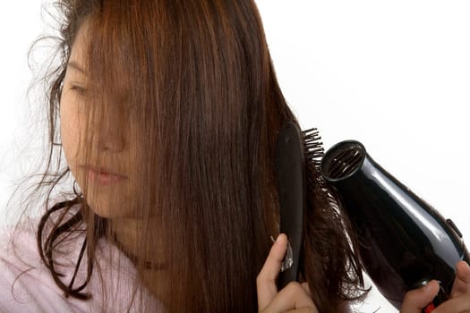 Girl blow-drying her hair