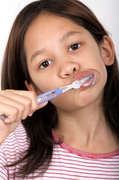 Girl brushing her teeth