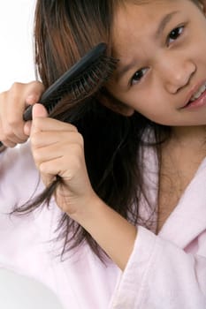 Girl brushing hair