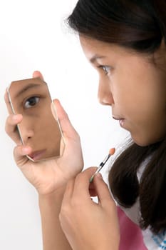 Girl putting on make-up
