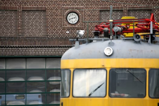 Historic railcar in front of a station building