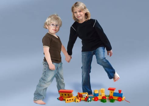 Siblings hand in hand