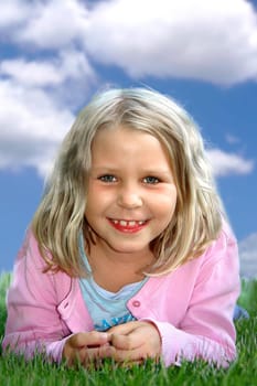 Girl 6 years lying on meadow