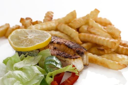 fried salmon with French fries and salad