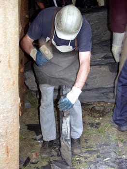Worker splits slate