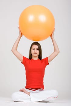 Young woman with exercise ball 8