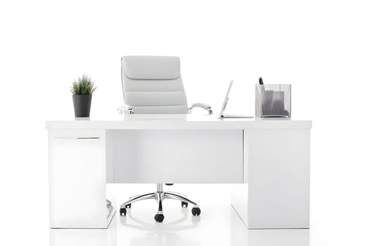 Office workplace desk in front of empty chair isolated on white background. Neural network generated in May 2023. Not based on any actual scene or pattern.
