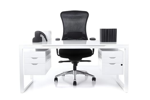 Office workplace desk in front of empty chair isolated on white background. Neural network generated in May 2023. Not based on any actual scene or pattern.