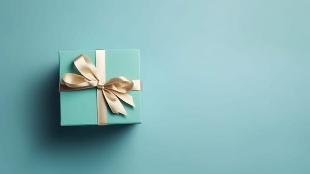 One gift box in craft wrapping paper and satin ribbon with bow on light blue clean flat surface background. Neural network generated in May 2023. Not based on any actual person, scene or pattern.