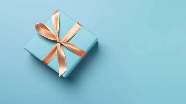 One gift box in craft wrapping paper and satin ribbon with bow on light blue clean flat surface background. Neural network generated in May 2023. Not based on any actual person, scene or pattern.