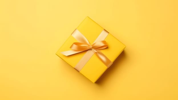 One yellow gift box in craft wrapping paper and satin ribbon with bow on yellow clean flat surface background. Neural network generated in May 2023. Not based on any actual person, scene or pattern.