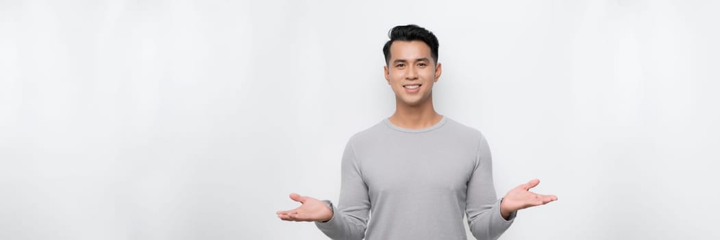  asian young man with both hands presenting something