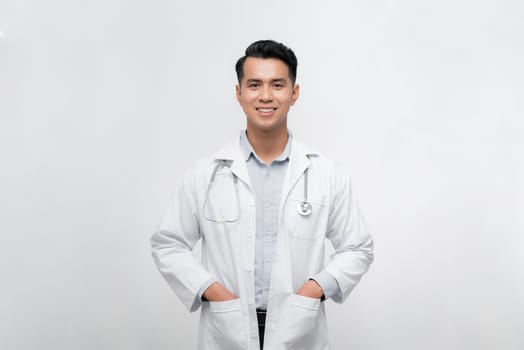 Young handsome man wearing doctor uniform and stethoscope with a happy and cool smile on face.
