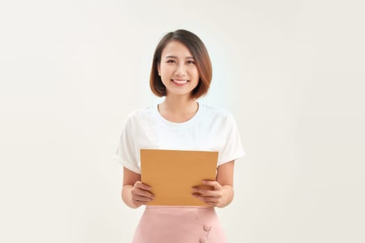 Businesswoman showing letter in yellow envelope