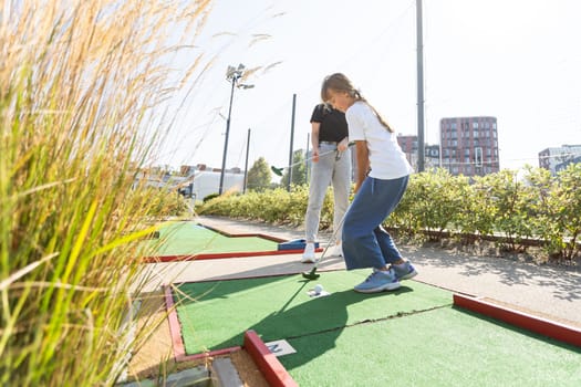 Minigolf player detail on green grass. High quality photo