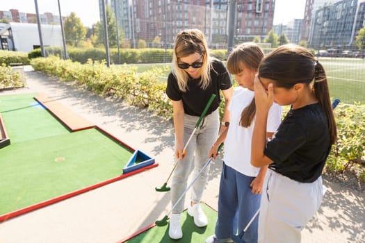 Minigolf player detail on green grass. High quality photo