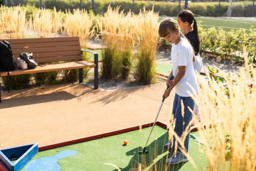 Minigolf player detail on green grass. High quality photo