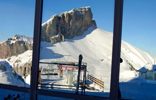 Window of the Kuklos restaurant on la Berneuse,reflection of the Tour d'Ai,Leysin,Vaud,Switzerland