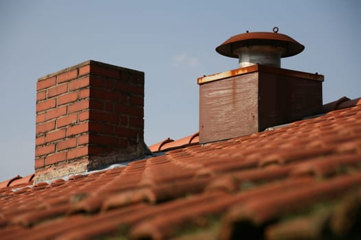A roof ridge with two chimneys