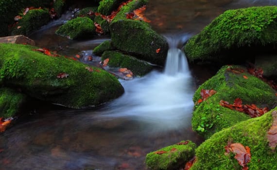 The stream babbles softly in the darkness of the valley. Delicate rays of light combine the green of the moss and the white of the cascade to create a lovely place. Oh,what a pity that I have to move on. --- This is the more original version with less chroma key (ha