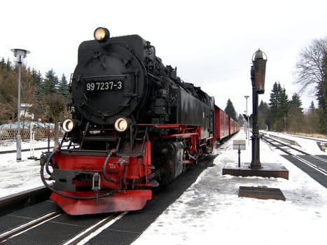 Recorded in Drei Annen Hohne in the Harz Mountains. Before the locomotive starts the difficult journey to the Brocken,it gets a few hundred litres of water.