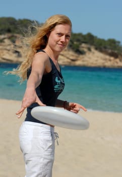 Woman throws Frisbee