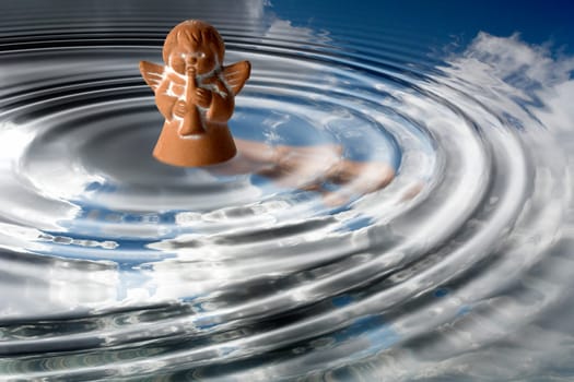 Little angel playing in the water