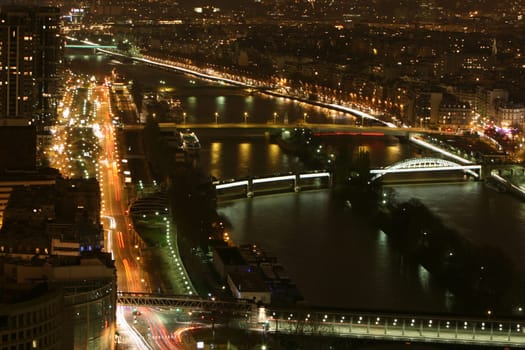 View from the Eiffel Tower to the Port de Grenelle,next to it the river Seine which flows from east to west and flows into the English Channel. With a length of 776 km,it is the third longest river in France.