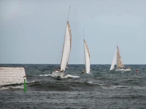 Running in during a storm in Simrishamn,stitched together from three different photos.