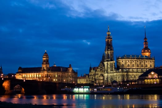 Dresden - View at the blue hour of Augustus Bridge,Higher Regional Court,Hofkirche,Residenzschloss alte Wache and Theaterkahn
