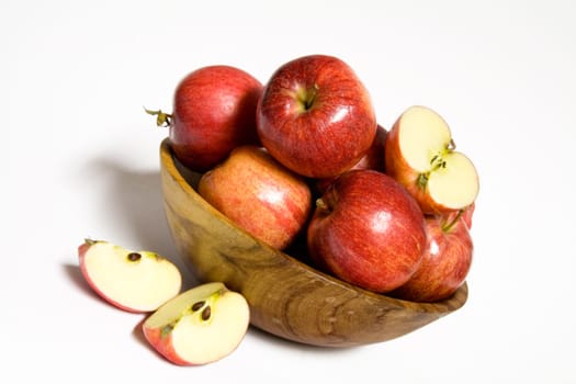 red apples in wooden bowl
