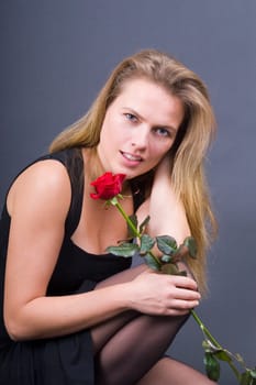 Miryam with rose on her knee