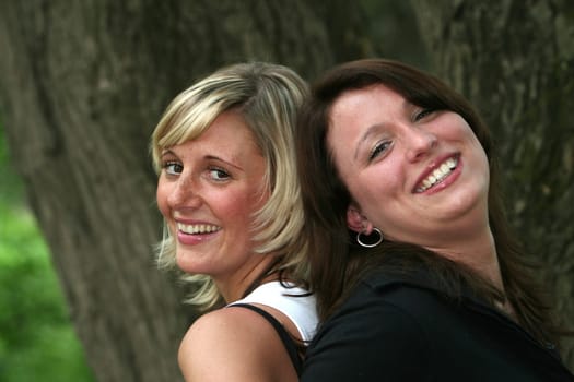 two cheerful young girlfriends