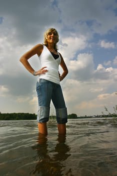 Pretty young blonde in the water