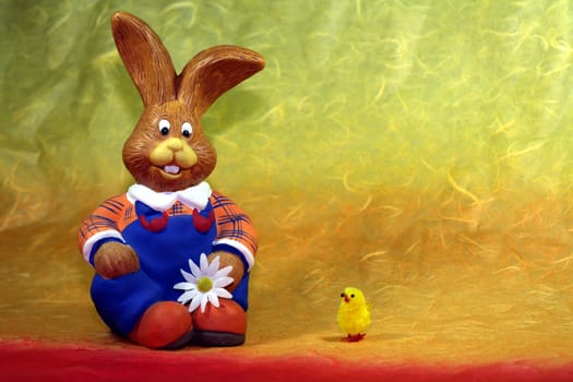 Rabbit figure in blue dungarees with pet