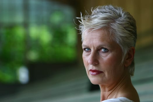 white-haired woman in her 50s