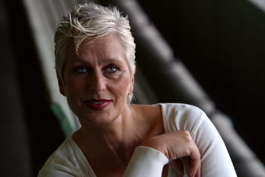 white-haired woman in her 50s