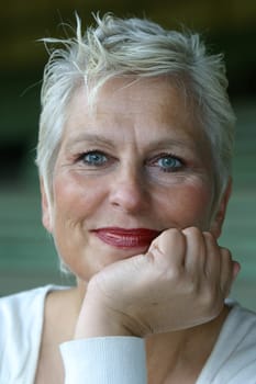 white-haired woman in her 50s