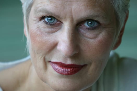 white-haired woman in her 50s